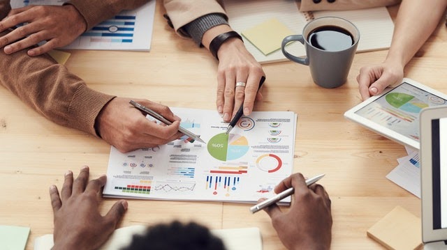A group of people doing data analysis