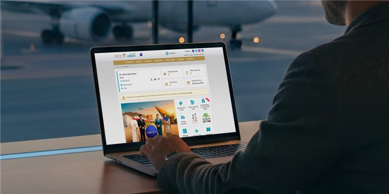 A user interacting with the Oman Air frequent flier platform, designed by Aufait UX